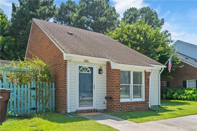 3842 Sir Francis Drake Dr, Chesapeake, VA 23321 - bungalow-style house featuring roof with shingles, brick siding, and a front lawn