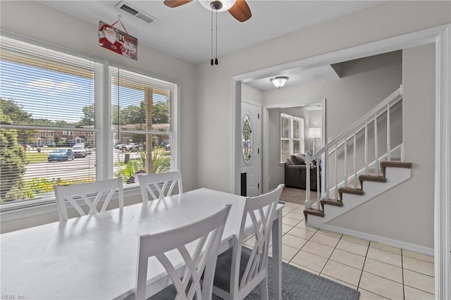 4715 Donelson Rd, Virginia Beach, VA 23455 - dining room featuring light tile patterned floors, a ceiling fan, and stairs