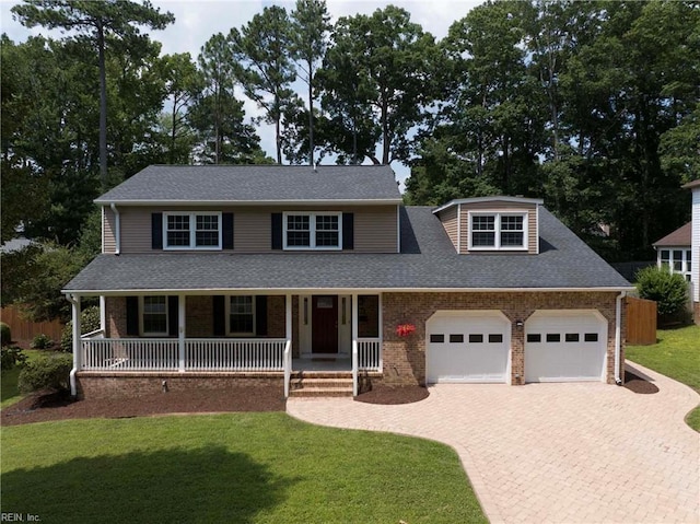 23 Paula Maria Dr, Newport News, VA 23606 - view of front of property featuring decorative driveway, a porch, a front lawn, brick siding, and a garage