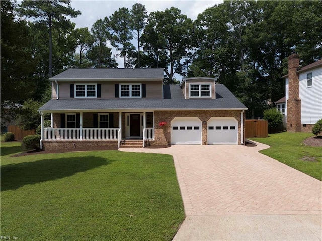 23 Paula Maria Dr, Newport News, VA 23606 - view of front of house with decorative driveway, a porch, a garage, a shingled roof, and brick siding