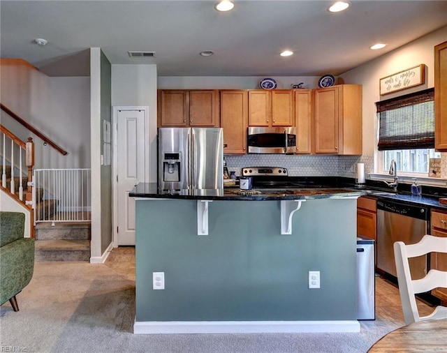 3472 Westham Ln, Toano, VA 23168 - kitchen featuring appliances with stainless steel finishes, light carpet, a center island, a kitchen bar, and recessed lighting
