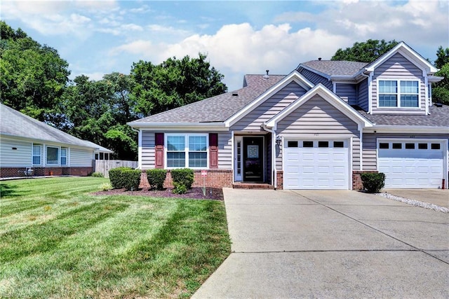 601 Commons Way, Williamsburg, VA 23185 - view of front of home with concrete driveway, brick siding, and roof with shingles
