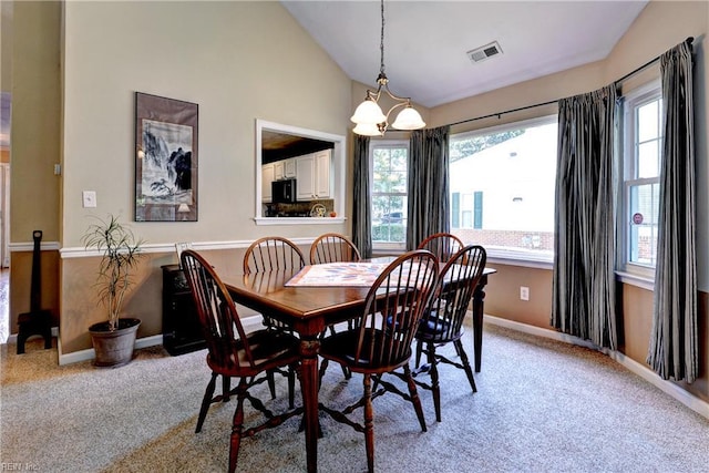 601 Commons Way, Williamsburg, VA 23185 - dining space featuring lofted ceiling, light colored carpet, and a chandelier
