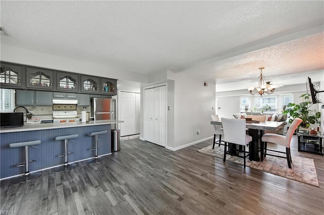 3725 Kingsmill Walk, Virginia Beach, VA 23452 - dining room featuring a chandelier, dark wood-style floors, and a textured ceiling