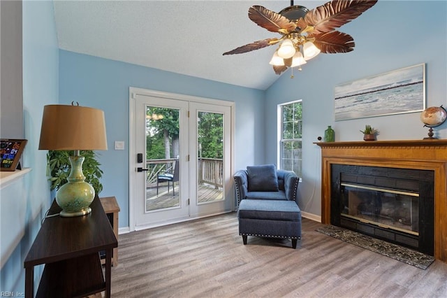 1504 River Creek Cres, Suffolk, VA 23434 - sitting room with wood finished floors, ceiling fan, lofted ceiling, and a glass covered fireplace