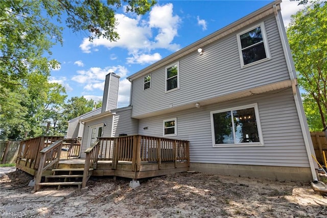 1504 River Creek Cres, Suffolk, VA 23434 - back of property with a chimney and a deck
