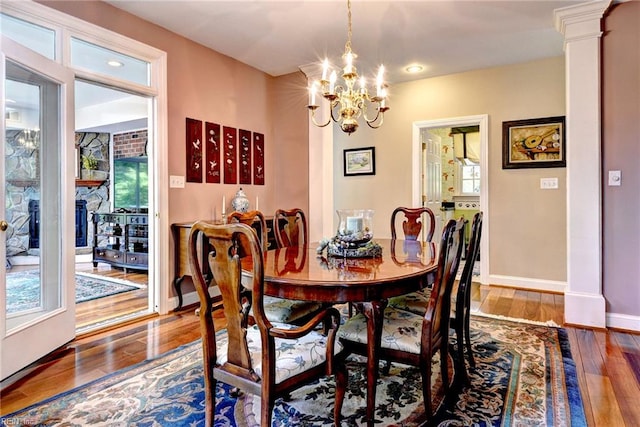 2093 Harpers Ml, Williamsburg, VA 23185 - dining area featuring a chandelier, wood finished floors, recessed lighting, and decorative columns