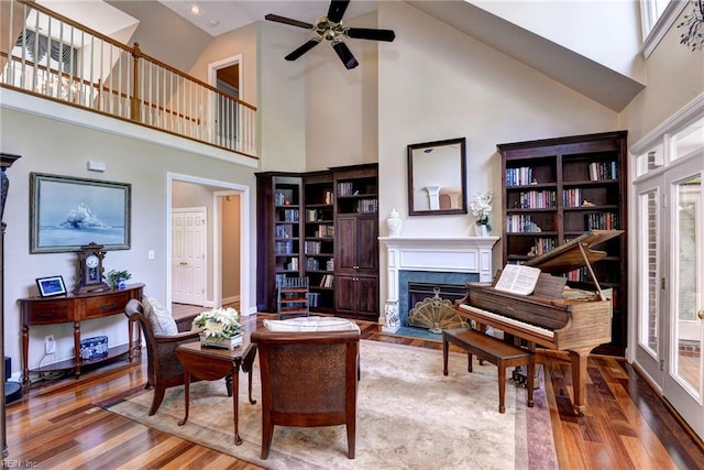 2093 Harpers Ml, Williamsburg, VA 23185 - living room with high vaulted ceiling, a fireplace with flush hearth, ceiling fan, wood finished floors, and recessed lighting