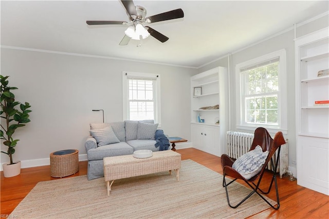 308 River Rd, Newport News, VA 23601 - living room featuring plenty of natural light, ornamental molding, built in shelves, and wood finished floors