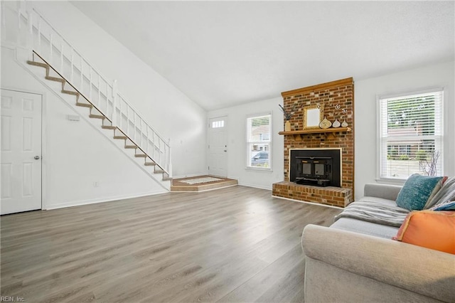 4136 Stonebridge Lndg, Chesapeake, VA 23321 - living room with stairs, healthy amount of natural light, wood finished floors, and vaulted ceiling