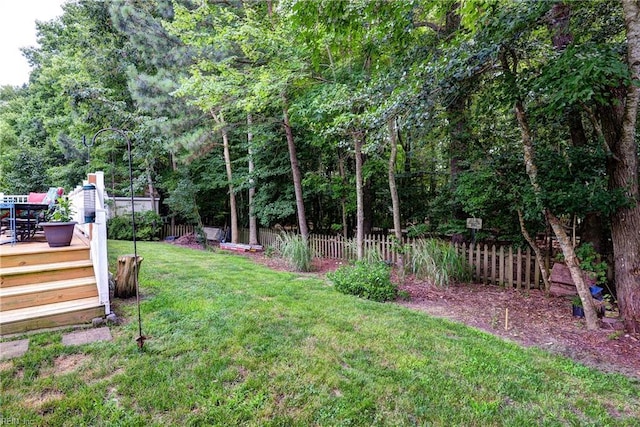 3284 Reades Way, Williamsburg, VA 23185 - fenced backyard with a wooden deck and outdoor dining space