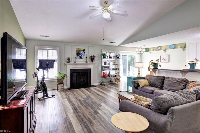 3284 Reades Way, Williamsburg, VA 23185 - living area with a ceiling fan, wood finished floors, vaulted ceiling, and a fireplace