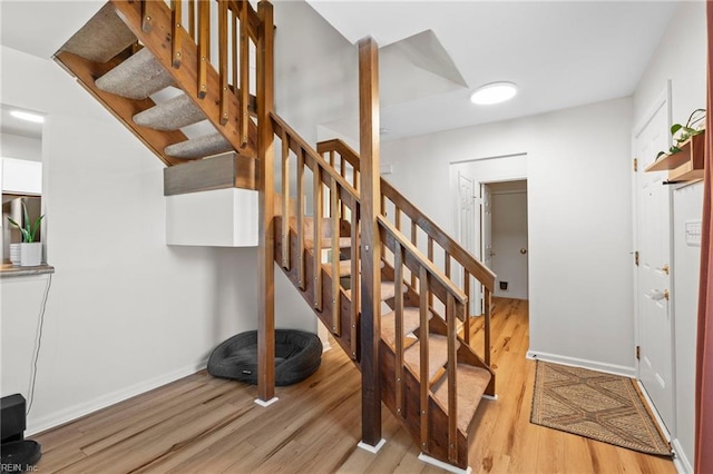 701 Hecate Dr, Virginia Beach, VA 23454 - stairs with wood finished floors and baseboards