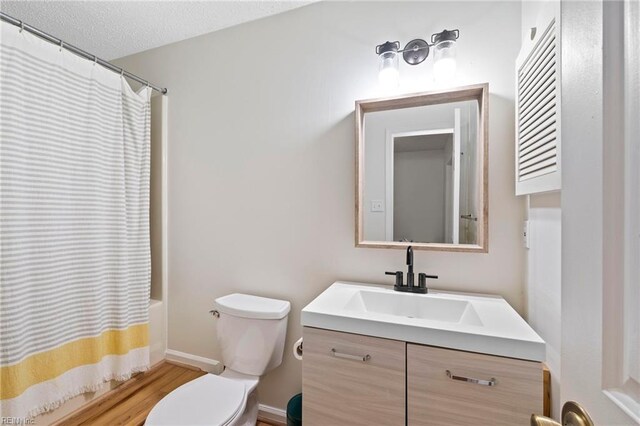 701 Hecate Dr, Virginia Beach, VA 23454 - bathroom with vanity, shower / tub combo with curtain, and wood finished floors