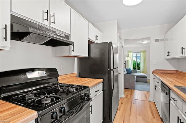 701 Hecate Dr, Virginia Beach, VA 23454 - kitchen with gas range, under cabinet range hood, dishwasher, light wood-type flooring, and butcher block countertops