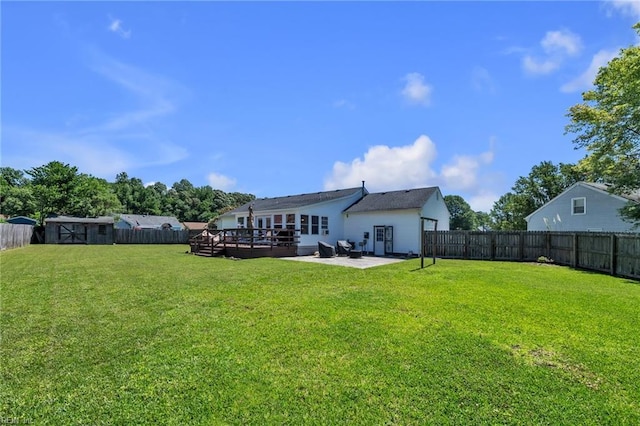 3414 Winterhawk Ct, Chesapeake, VA 23323 - rear view of house featuring a fenced backyard, a patio area, a deck, and a storage unit