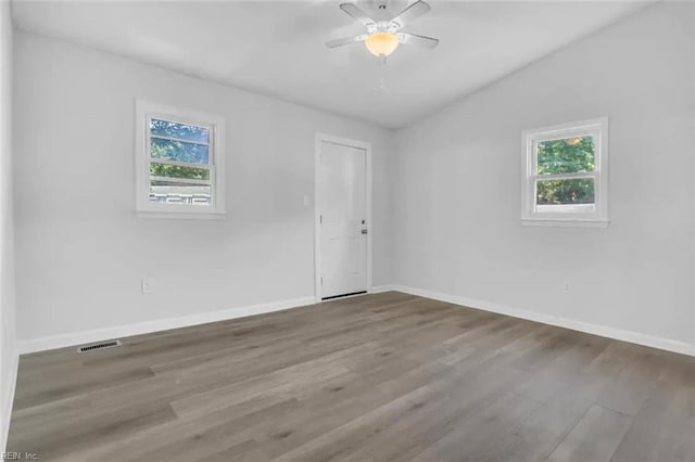 11 Alpine St, Newport News, VA 23606 - unfurnished room featuring healthy amount of natural light, wood finished floors, ceiling fan, and vaulted ceiling