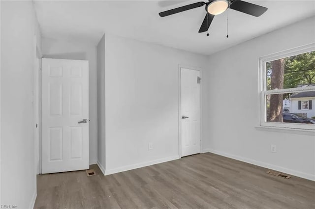 11 Alpine St, Newport News, VA 23606 - unfurnished bedroom with wood finished floors and ceiling fan