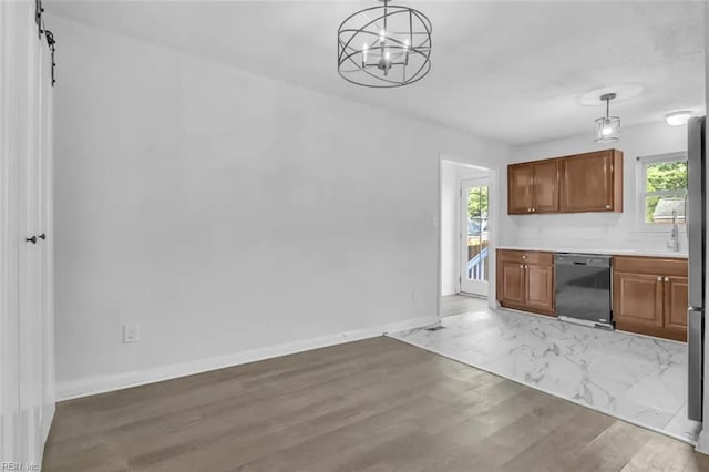 11 Alpine St, Newport News, VA 23606 - kitchen featuring dishwasher, a chandelier, brown cabinetry, light countertops, and pendant lighting