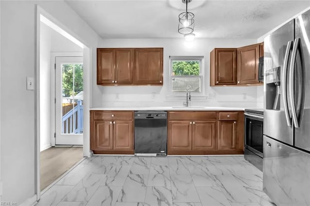 11 Alpine St, Newport News, VA 23606 - kitchen featuring appliances with stainless steel finishes, brown cabinetry, and light countertops