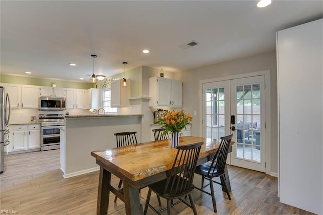 408 Lodge Cv, Chesapeake, VA 23323 - dining area featuring french doors, light wood-style flooring, and recessed lighting