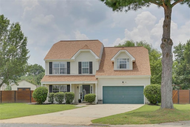 408 Lodge Cv, Chesapeake, VA 23323 - view of front facade with concrete driveway, an attached garage, and roof with shingles