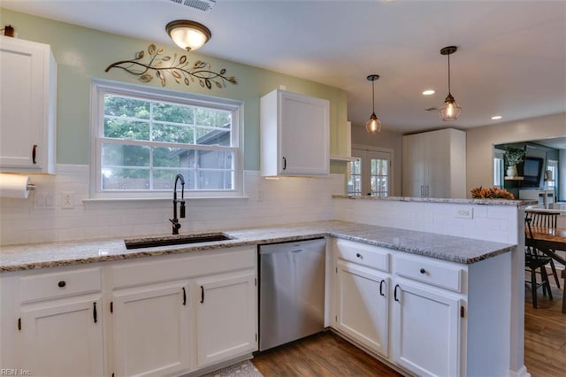 408 Lodge Cv, Chesapeake, VA 23323 - kitchen featuring dishwasher, a peninsula, white cabinetry, backsplash, and recessed lighting