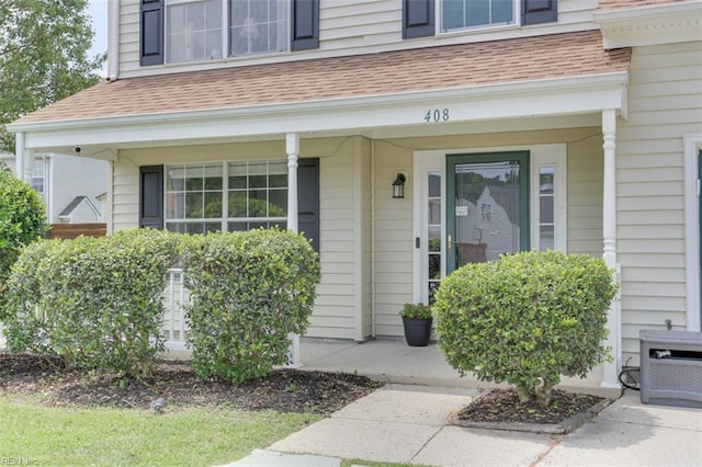 408 Lodge Cv, Chesapeake, VA 23323 - doorway to property featuring roof with shingles and covered porch