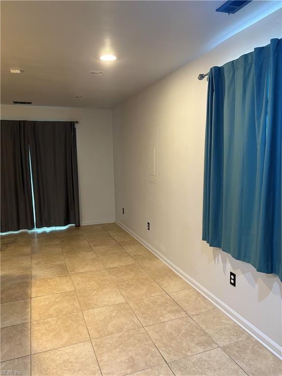 1122 Gatling Dr, Hampton, VA 23666 - spare room featuring baseboards and light tile patterned floors
