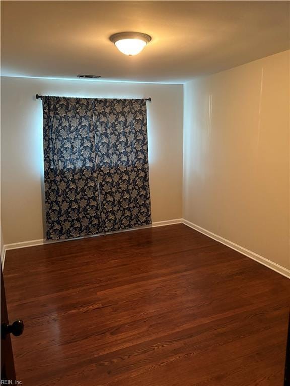 1122 Gatling Dr, Hampton, VA 23666 - empty room with baseboards and dark wood-type flooring