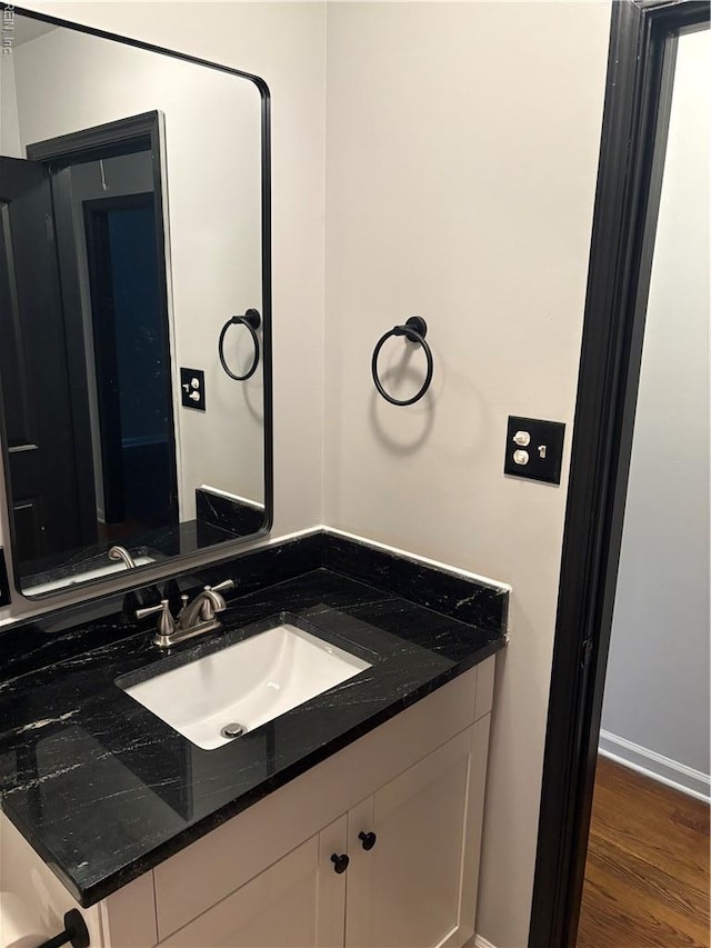 1122 Gatling Dr, Hampton, VA 23666 - bathroom featuring vanity and wood finished floors