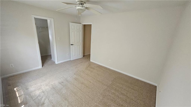275 Jonathans Way, Suffolk, VA 23434 - unfurnished bedroom with a walk in closet, carpet floors, a closet, and a ceiling fan