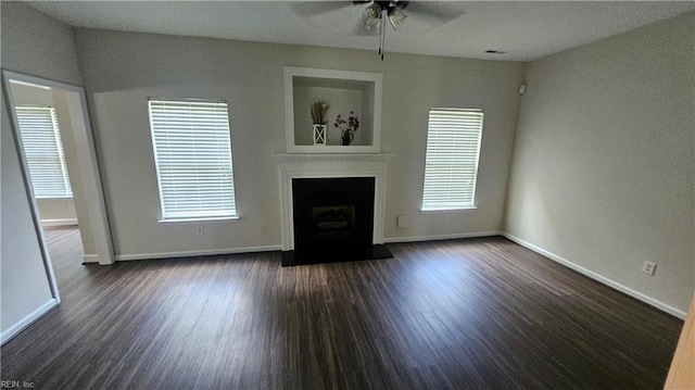 275 Jonathans Way, Suffolk, VA 23434 - unfurnished living room featuring ceiling fan, dark wood-style flooring, and a fireplace with raised hearth