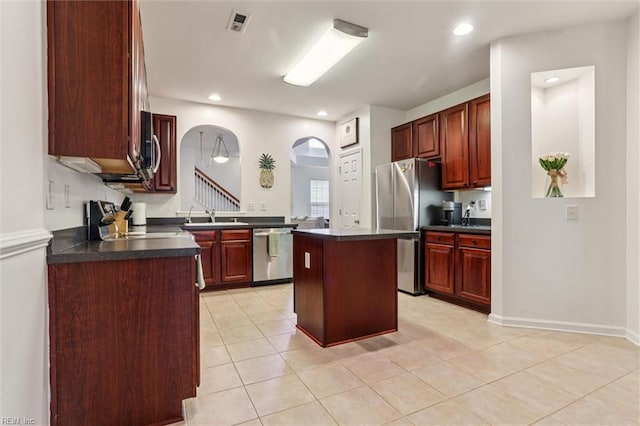4208 Falcon Creek Dr, Williamsburg, VA 23188 - kitchen with stainless steel appliances, dark countertops, dark brown cabinets, and recessed lighting