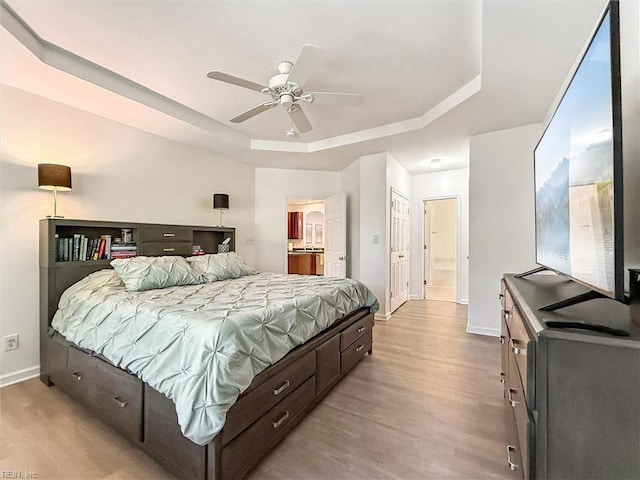 4208 Falcon Creek Dr, Williamsburg, VA 23188 - bedroom with a raised ceiling, ensuite bath, wood finished floors, and ceiling fan