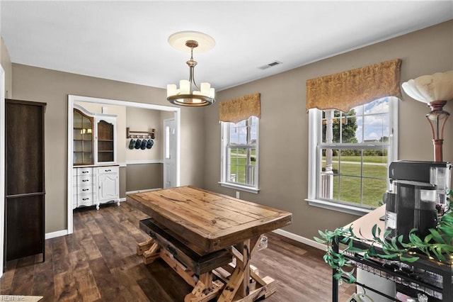 114 Climbing Vine Run, Elizabeth City, NC 27909 - dining room featuring a chandelier, healthy amount of natural light, and dark wood-style flooring