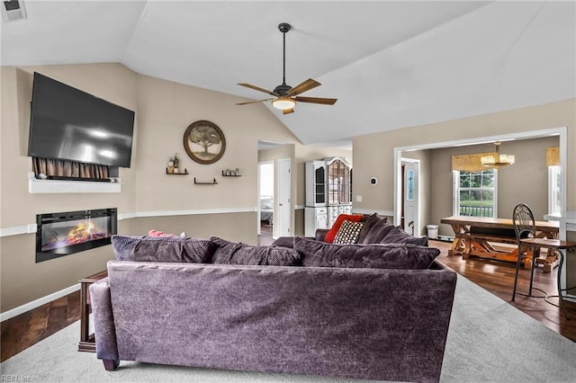 114 Climbing Vine Run, Elizabeth City, NC 27909 - living area with vaulted ceiling, wood finished floors, a glass covered fireplace, and ceiling fan