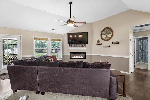 114 Climbing Vine Run, Elizabeth City, NC 27909 - living room featuring vaulted ceiling, dark wood-style floors, ceiling fan, and a glass covered fireplace