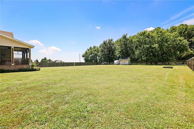 114 Climbing Vine Run, Elizabeth City, NC 27909 - fenced backyard featuring a storage shed and a sunroom