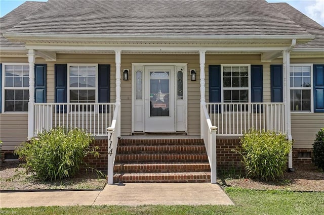 114 Climbing Vine Run, Elizabeth City, NC 27909 - entrance to property featuring a shingled roof and a porch