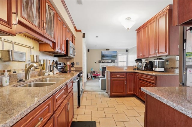 719 Kensington Dr, Newport News, VA 23602 - kitchen with electric range oven, crown molding, stainless steel microwave, open floor plan, and light stone countertops