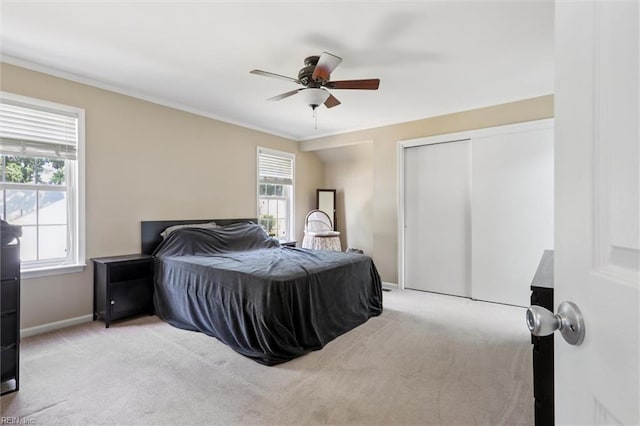 719 Kensington Dr, Newport News, VA 23602 - bedroom featuring a closet, ornamental molding, carpet flooring, and a ceiling fan