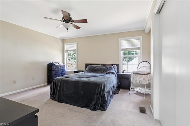 719 Kensington Dr, Newport News, VA 23602 - carpeted bedroom featuring multiple windows, crown molding, and ceiling fan