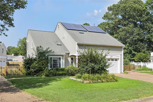 719 Kensington Dr, Newport News, VA 23602 - view of front of property featuring driveway, a garage, roof with shingles, and solar panels