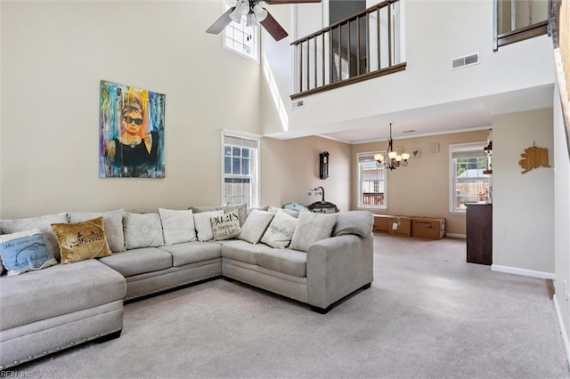 719 Kensington Dr, Newport News, VA 23602 - living room with carpet floors, ceiling fan, a chandelier, and a high ceiling