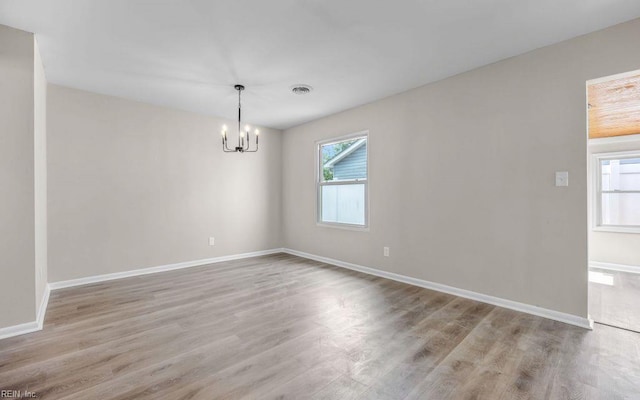 3549 Dandelion Cres, Virginia Beach, VA 23453 - empty room featuring wood finished floors and a chandelier