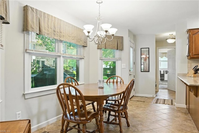 3805 Fleet Ct, Portsmouth, VA 23703 - dining space with a chandelier and light tile patterned floors