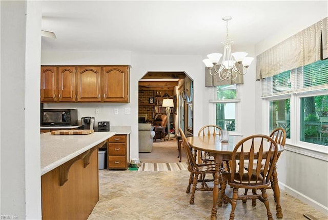 3805 Fleet Ct, Portsmouth, VA 23703 - dining space with arched walkways and a chandelier