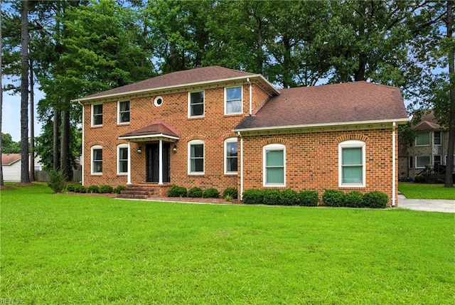 3805 Fleet Ct, Portsmouth, VA 23703 - colonial house featuring a front lawn and brick siding