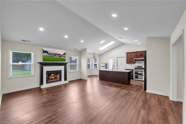 2416 Broadnax Cir, Chesapeake, VA 23323 - living room featuring lofted ceiling, a warm lit fireplace, dark wood-type flooring, and recessed lighting